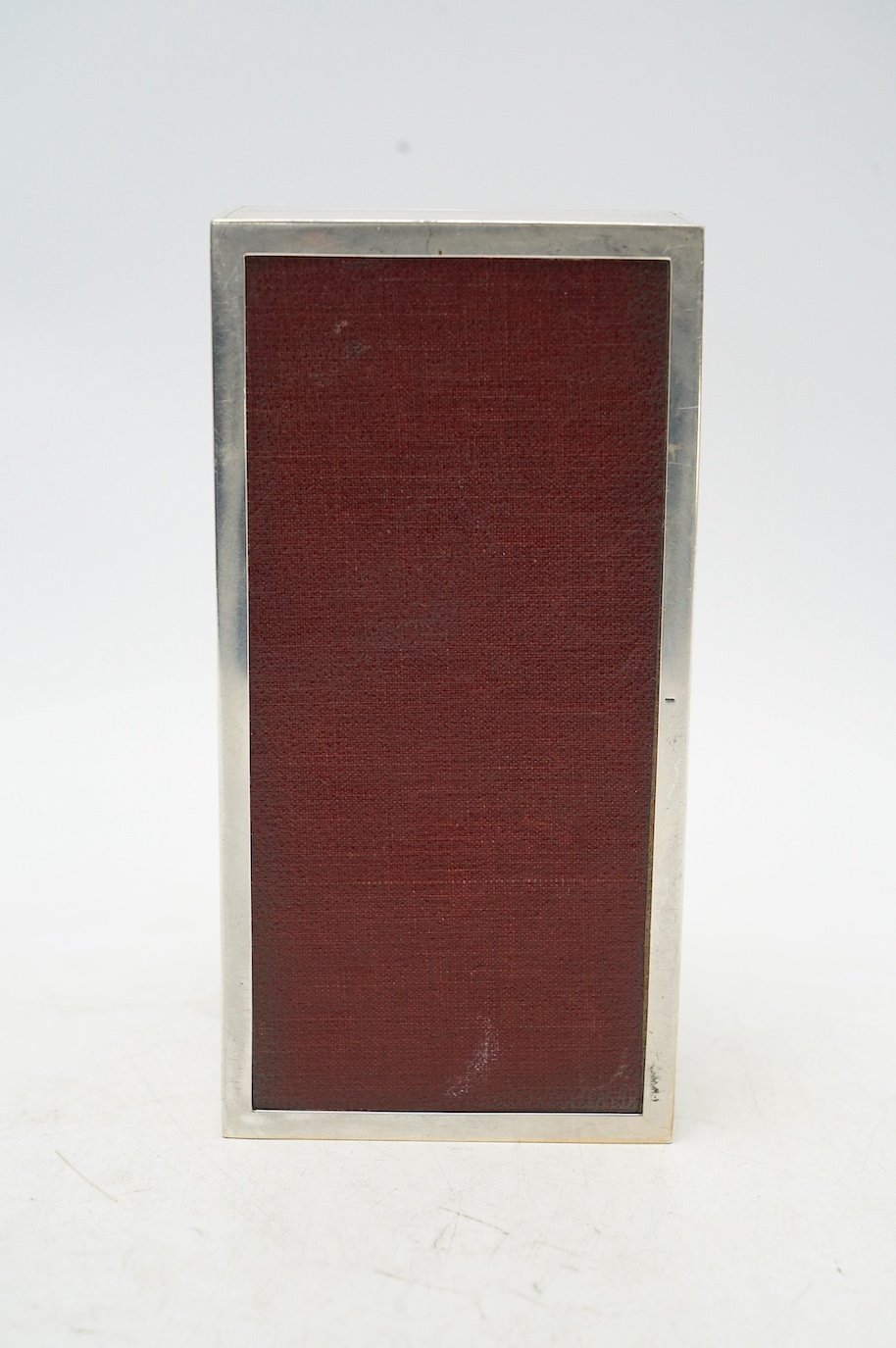 A George V engine turned silver mounted rectangular cigarette box, Padgett & Braham Ltd, London, 1926, 17.8cm. Condition - fair to good